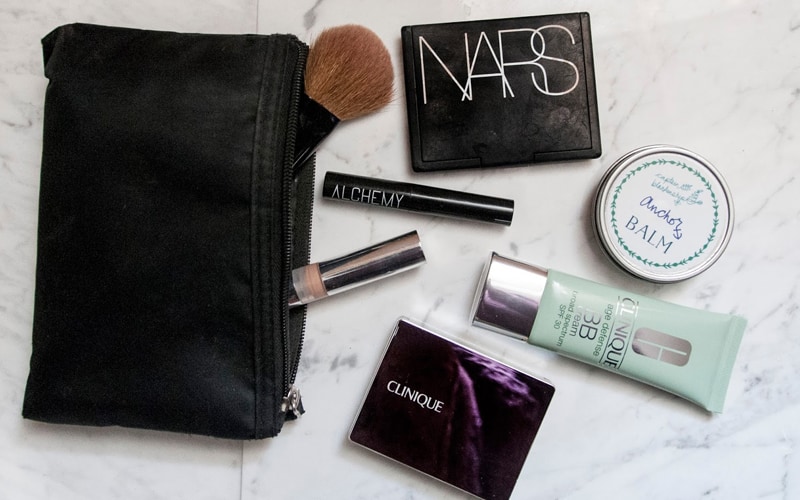 Makeup bag with makeup on side